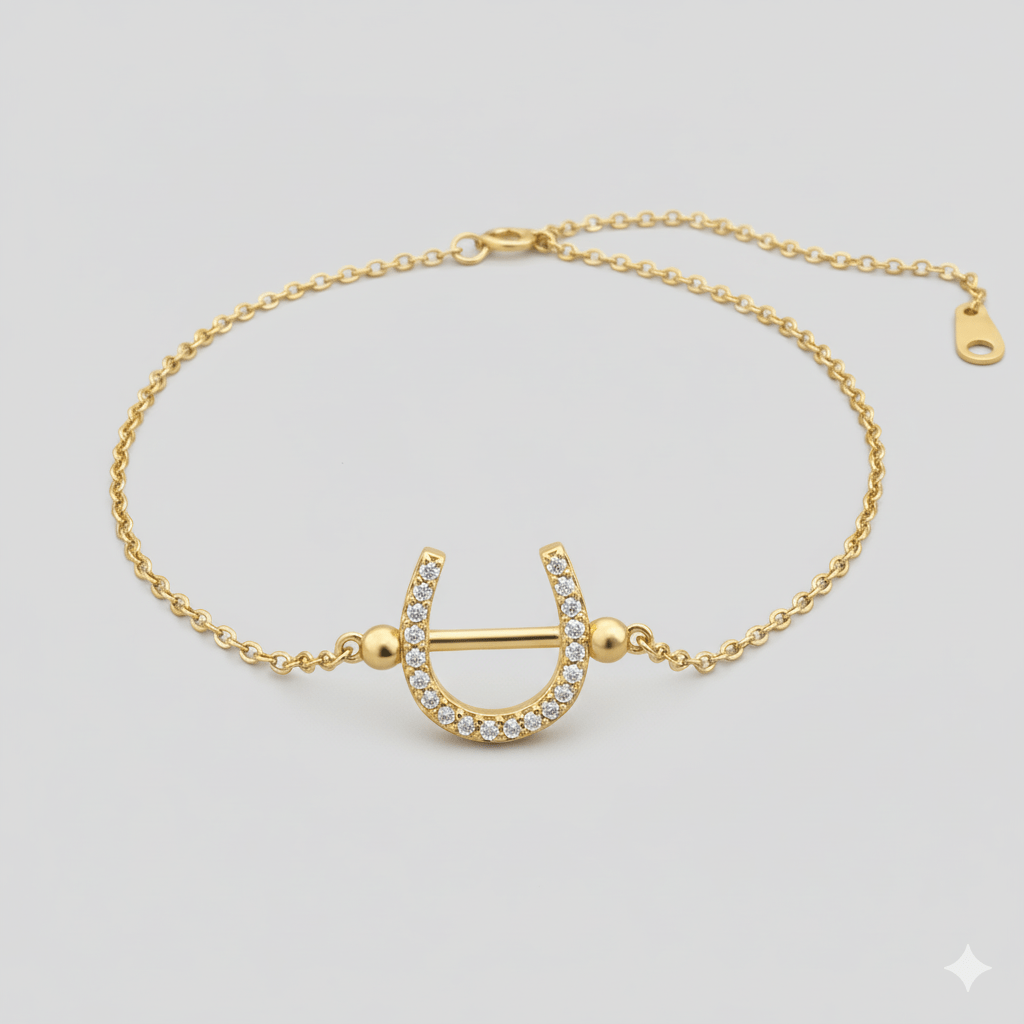 Goudkleurige hoefijzerarmband met zirkonia