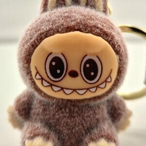 Monster sleutelhanger zittend bruin
