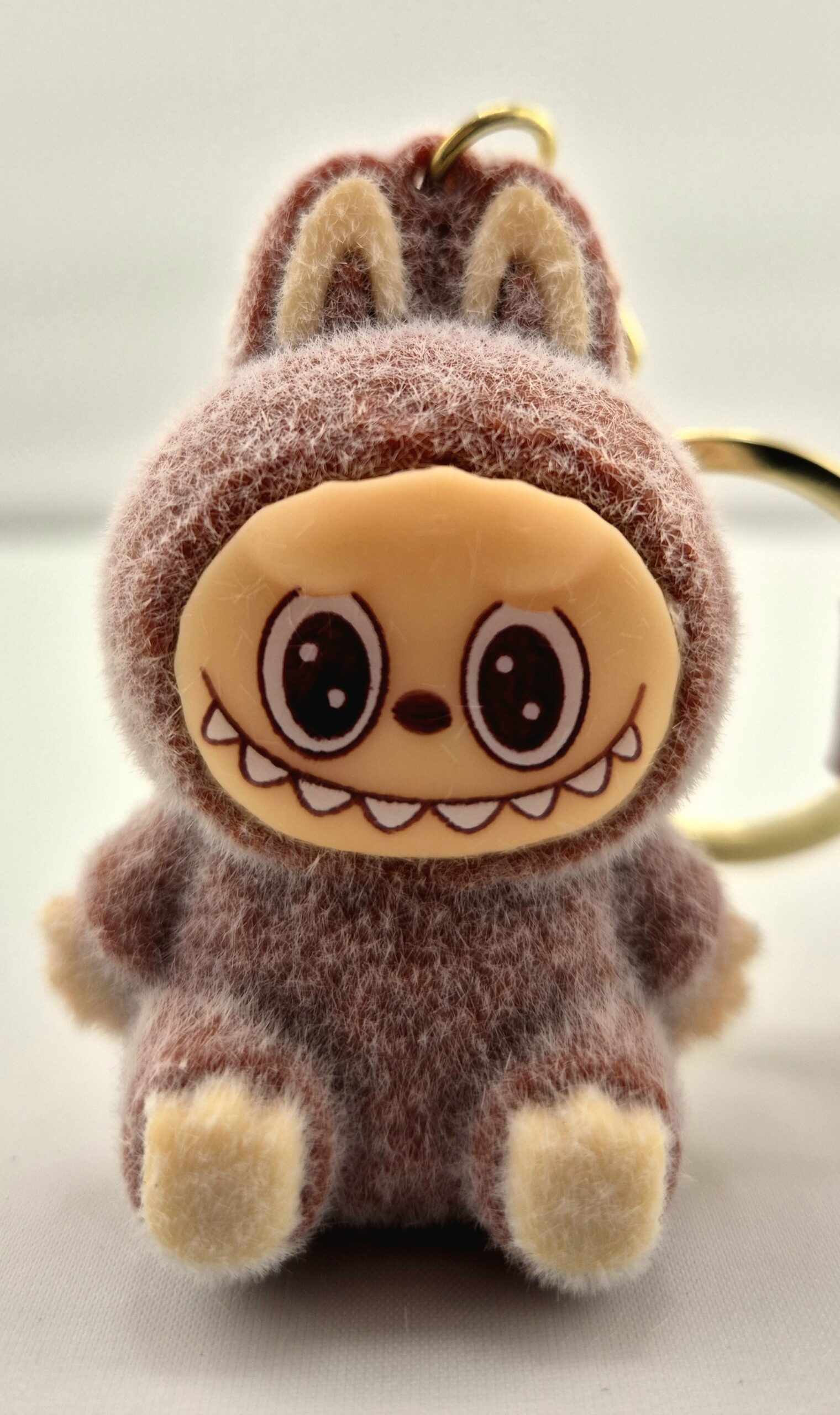 Monster sleutelhanger zittend bruin