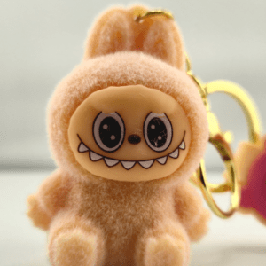 Monster sleutelhanger licht roze zittend